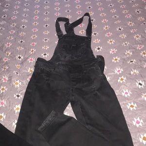 Celebrity pink distressed overalls